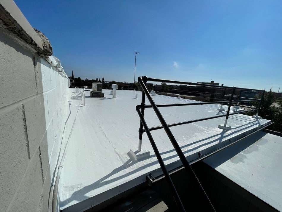 Completed fabric reinforced membrane restoration by Roof Tech LLC showcasing professional results and weather protection
