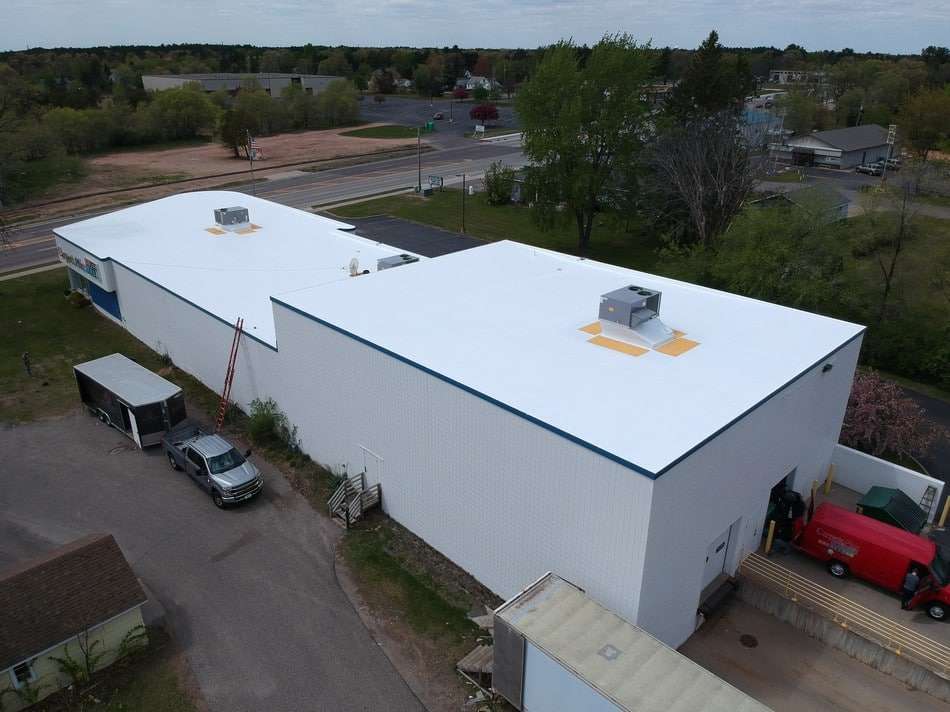 Professional fabric reinforced membrane restoration project showing superior coating application and leak prevention