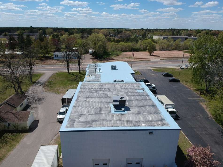 Fabric reinforced membrane restoration in progress showing professional application techniques and quality workmanship