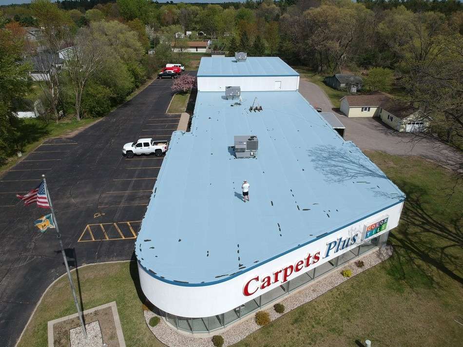 Fabric reinforced membrane restoration process by Roof Tech LLC showing quality installation and superior materials