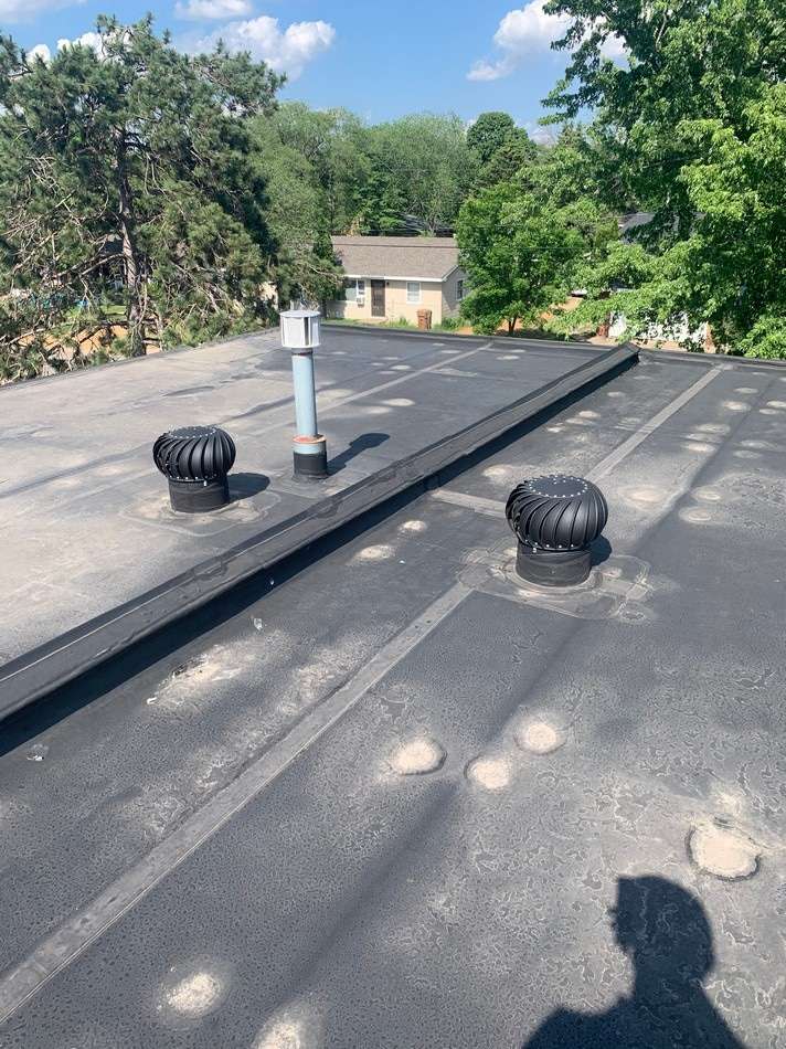 Pre-restoration membrane roofing condition demonstrating the need for professional membrane restoration services