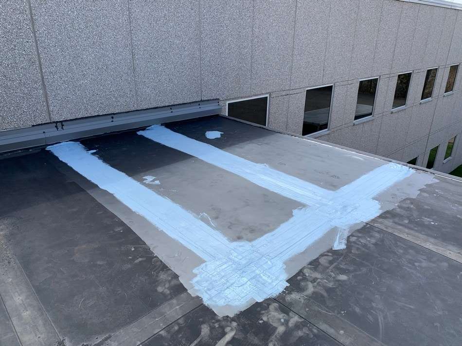 Professional membrane patching work demonstrating expert repair techniques and attention to detail for leak prevention