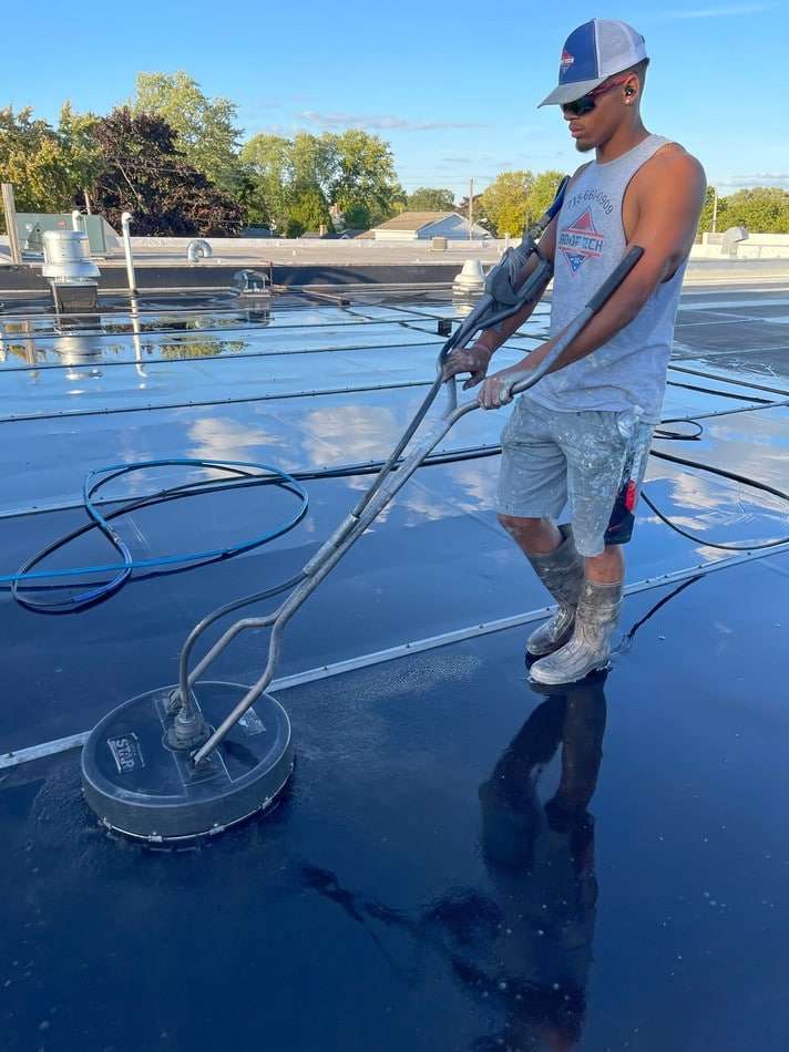 Professional membrane cleaning and preparation work ensuring optimal surface conditions for restoration coating