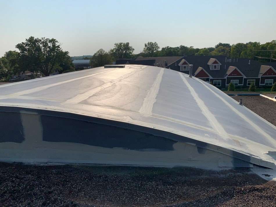 Membrane restoration in progress by Roof Tech LLC showing professional application and superior workmanship standards