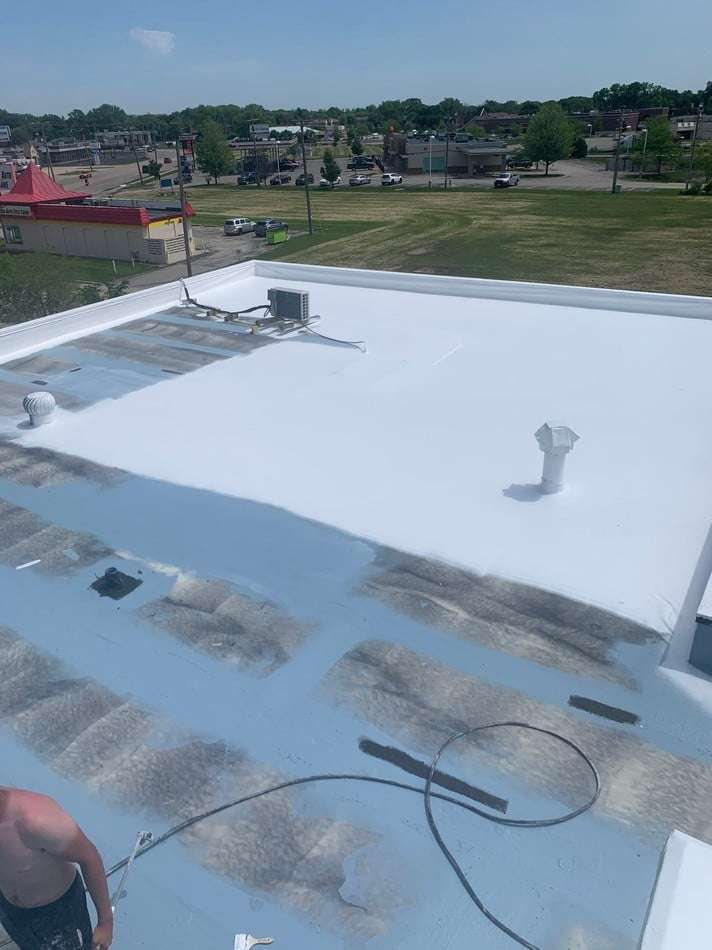 Membrane restoration work showing professional application methods and superior coating system installation
