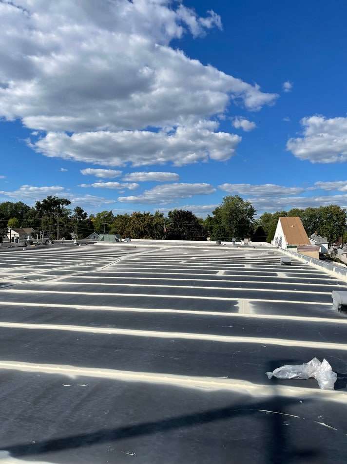 Membrane restoration process showing professional techniques and superior workmanship for long-lasting roof protection