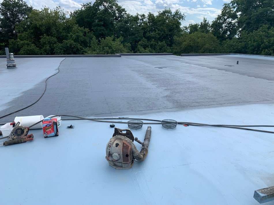 Membrane restoration work in progress showing professional installation techniques and superior coating application