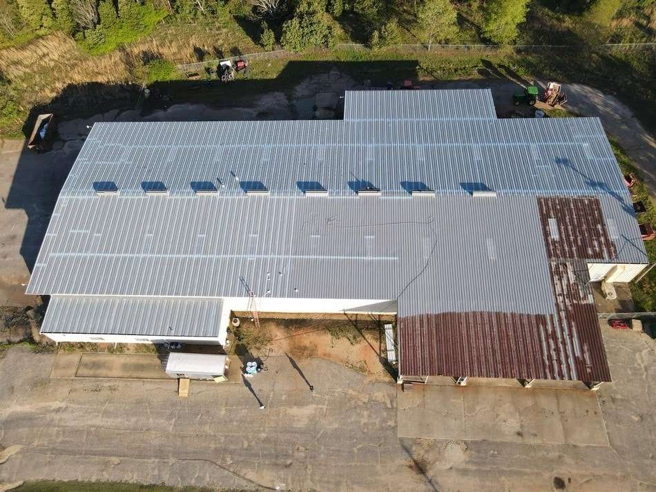Metal roof before restoration showing weathered condition requiring professional coating and restoration