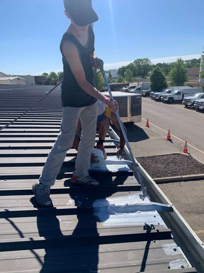 Professional metal roof restoration project showcasing expert preparation and coating application