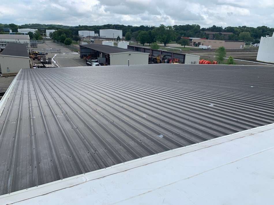 Commercial metal roof restoration project showing quality workmanship and attention to detail