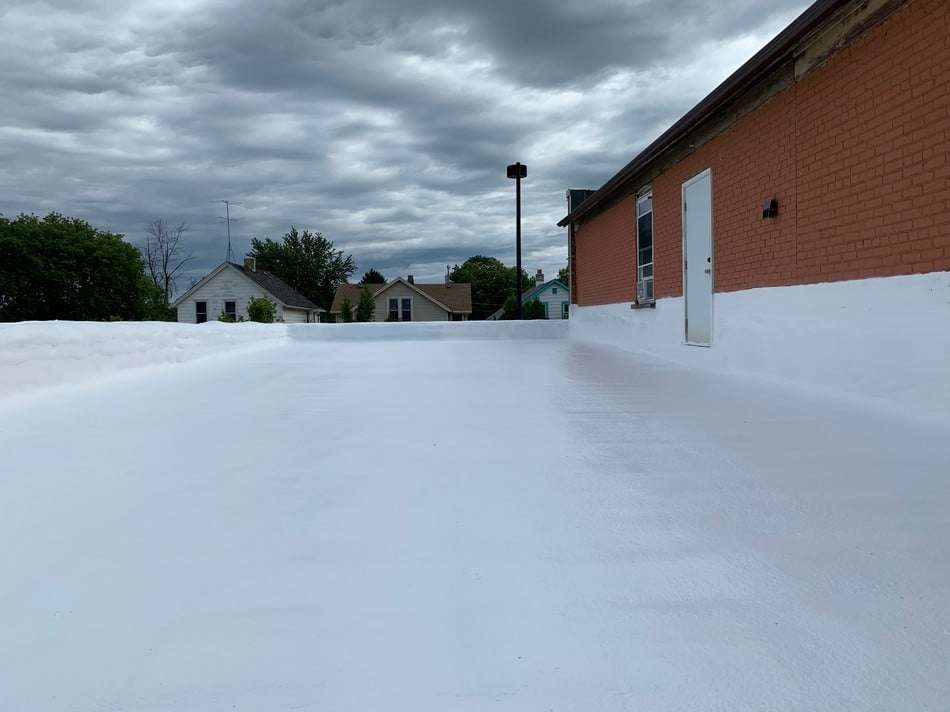 Completed spray foam roofing project demonstrating seamless application and energy-efficient insulation system