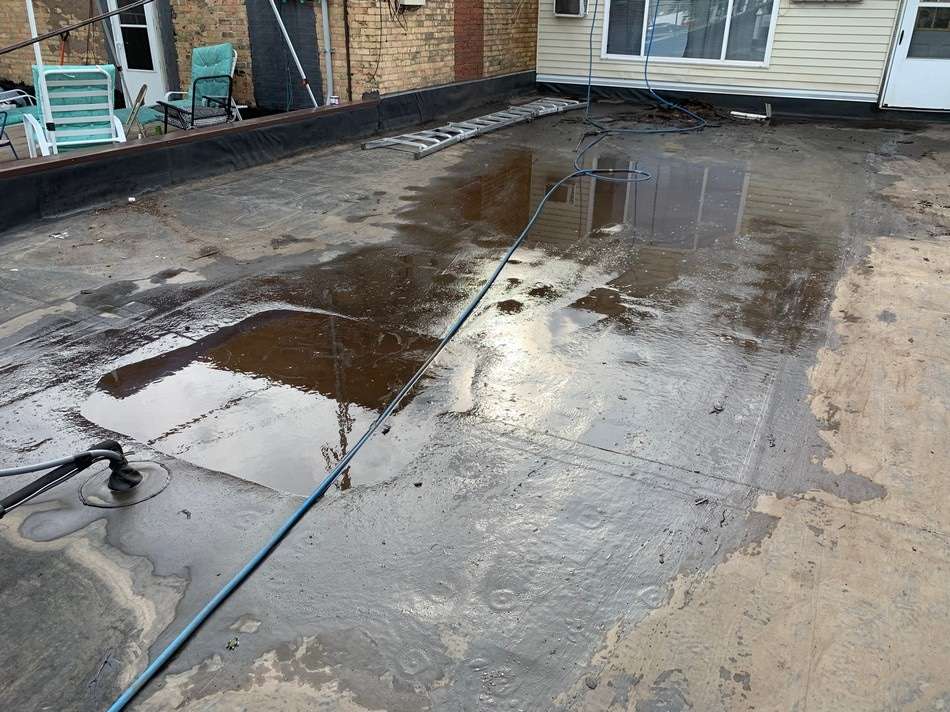 Commercial roof before spray foam installation showing condition requiring professional waterproof barrier application