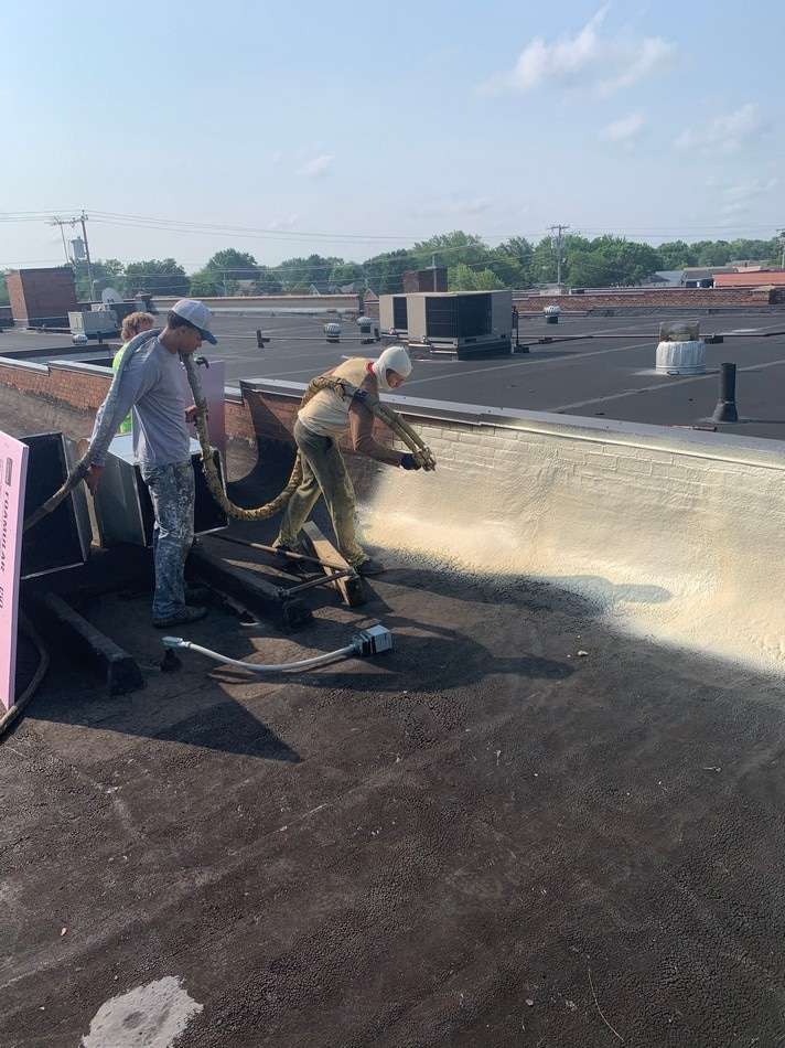 Spray foam roofing work by Roof Tech LLC showing seamless application and energy-efficient insulation system