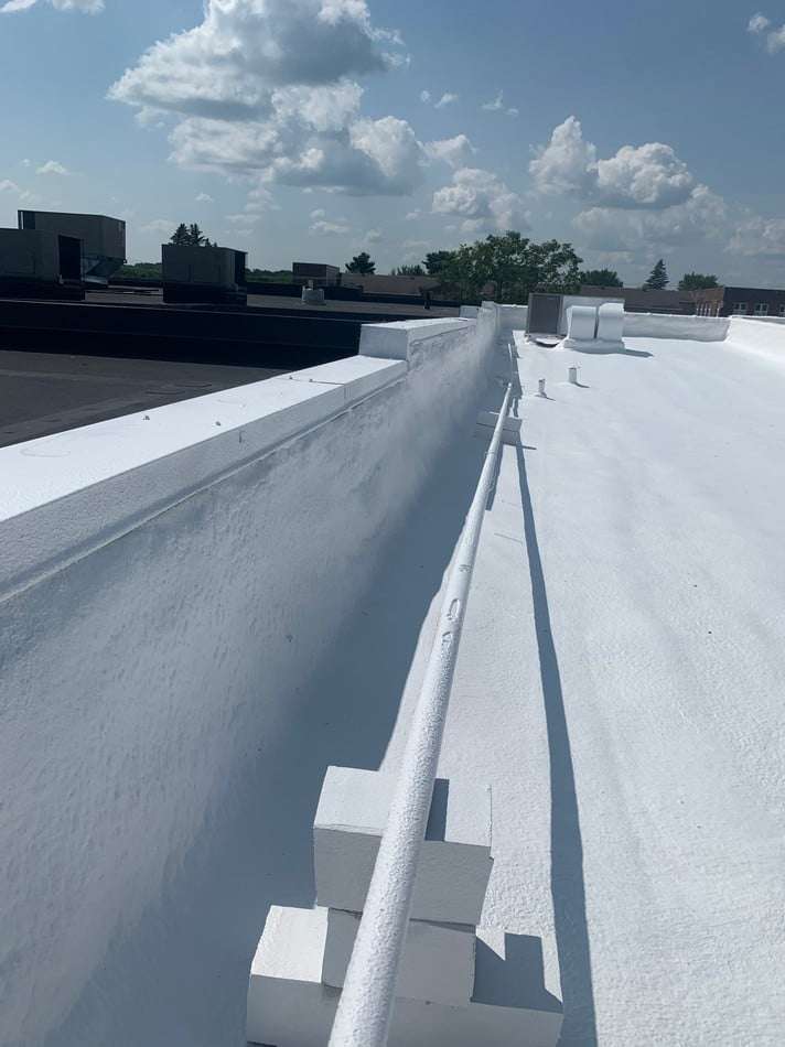 Spray foam roofing system application showing professional techniques and long-lasting protection capabilities