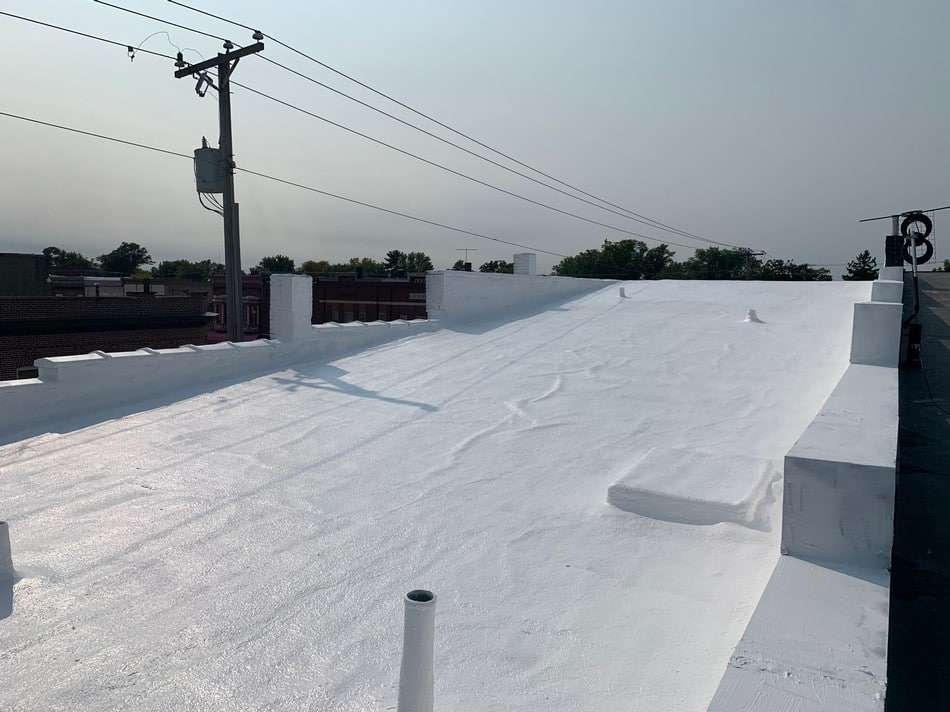 Commercial spray foam roofing installation showing seamless application and long-lasting protection capabilities
