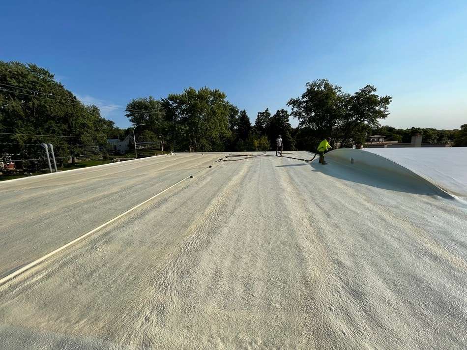 Spray foam roofing system by Roof Tech LLC showing expert installation and energy-efficient insulation properties